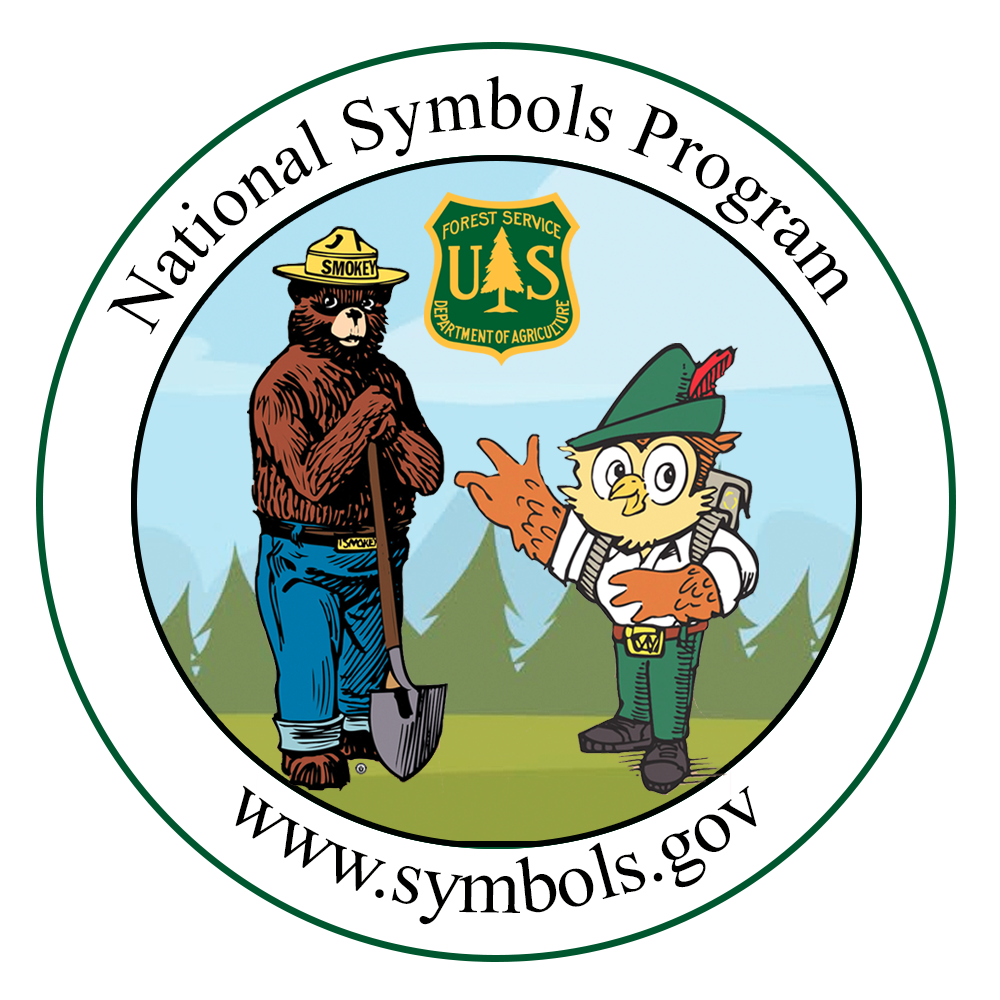 Smokey Bear and Woodsy Owl welcoming visitors to the Forest Service Store