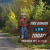 Fire danger level sign example - Smokey Bear with a low fire danger level on roadside